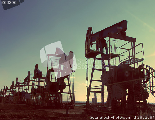 Image of oil pumps silhouette - vintage retro style