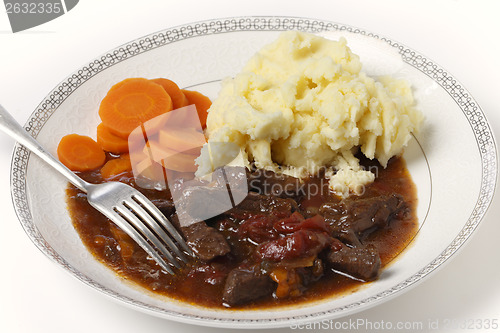 Image of Beef and tomato casserole with fork