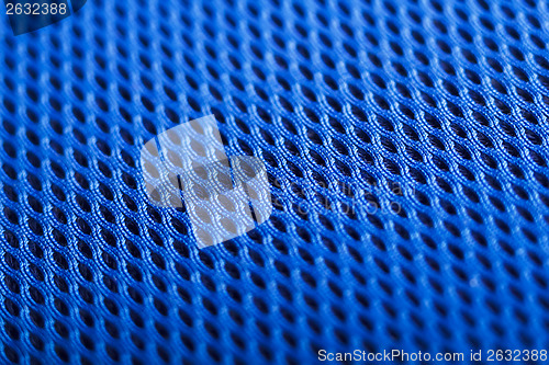 Image of Blue background. Mesh fabric texture. Macro