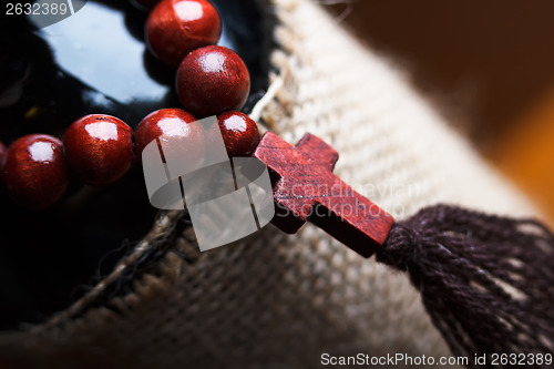 Image of wooden rosary with a cross