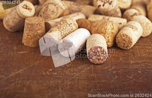 Image of bottle corks on the wooden background