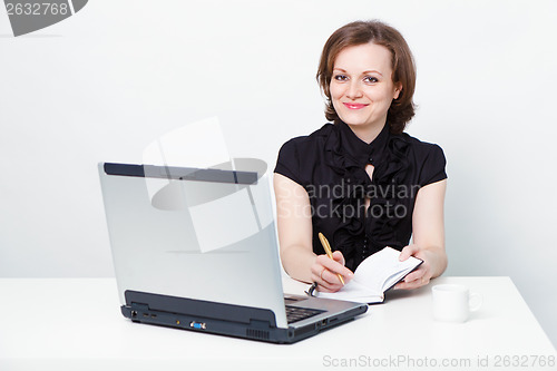 Image of attractive girl with a laptop