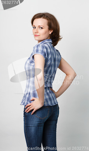 Image of girl in a plaid shirt and jeans