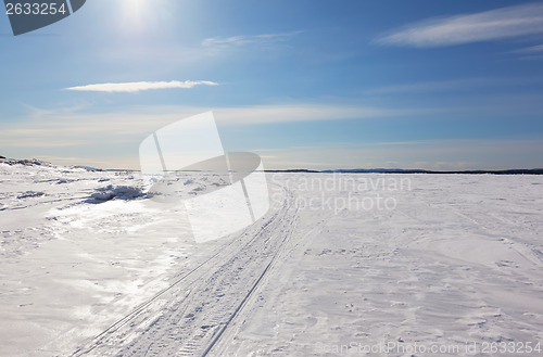 Image of Snowmobile trail stretching into the distance to the horizon 