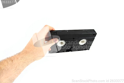 Image of VHS video tape in the human hand