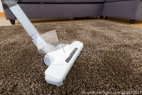 Image of Cleaning carpet with vacuum 
