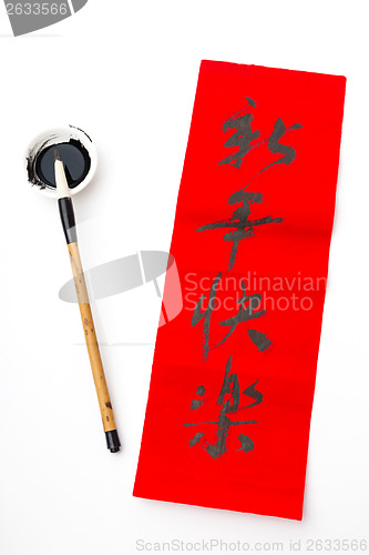 Image of Writing of chinese new year calligraphy, phrase meaning is happy