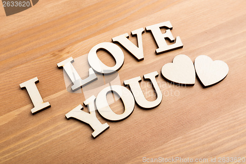 Image of Wooden texture letters forming with phrase I Love You 