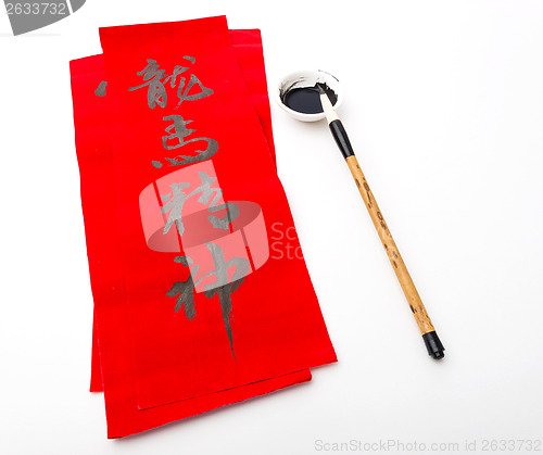 Image of Writing of chinese new year calligraphy, phrase meaning is bless