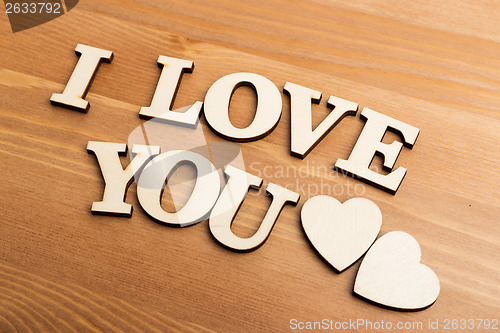 Image of Vintage wooden letters forming with phrase I Love You