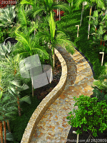 Image of Stone path in green tree garden