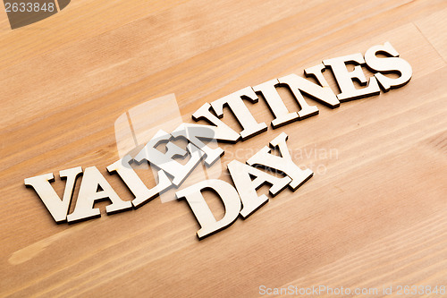 Image of Wooden letters forming phrase Valentines day over wooden backgro