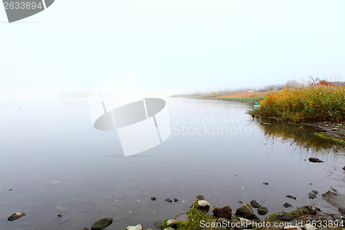 Image of Lake with smog at morning