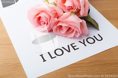 Image of Pink rose and gift card of message I Love You
