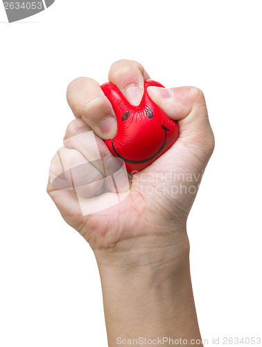 Image of Hand squeezing smile face stress ball