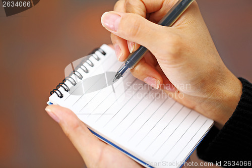 Image of Pen in hand writing