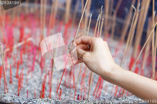 Image of Offering incense stick to god in Chinese temple