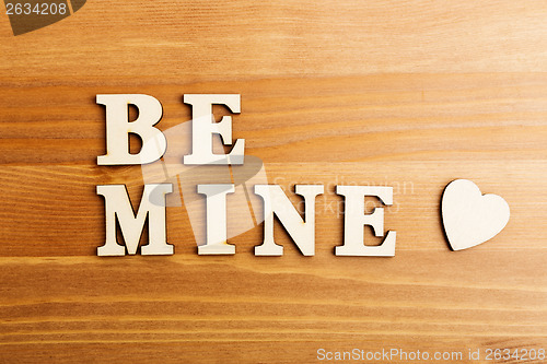 Image of Be mine wooden text