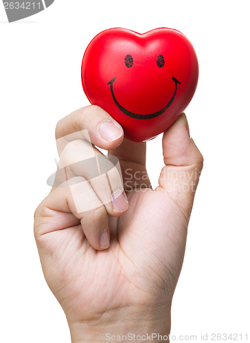 Image of Hand squeezing stress ball in heart shape