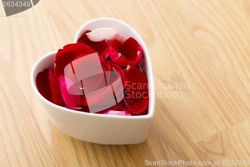 Image of Rose petal flower in heart bowl