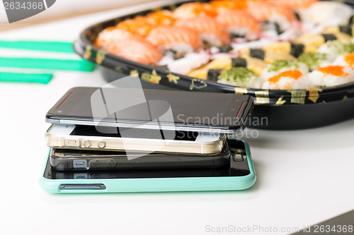 Image of Mobile phones and sushi