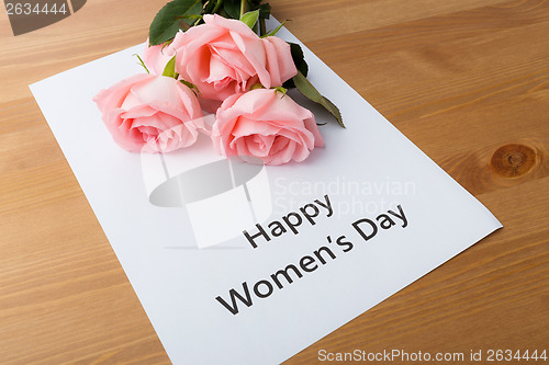 Image of Bouquet of pink roses with happy women day message