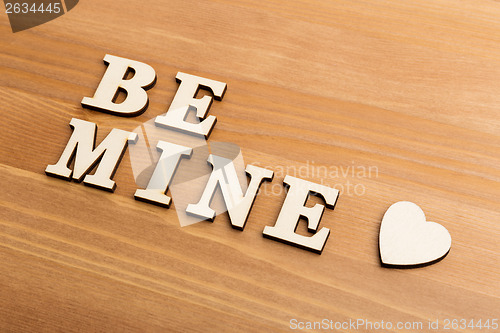 Image of Wooden letters forming be mine