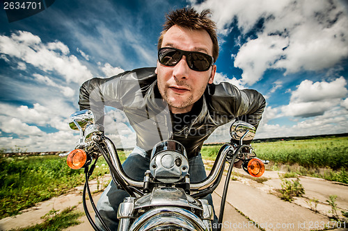 Image of Biker racing on the road