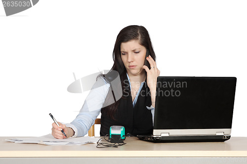 Image of Young woman behind a desk phone