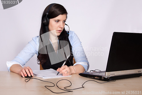 Image of Young woman with headset