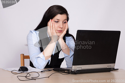 Image of Young woman desperate at the laptop