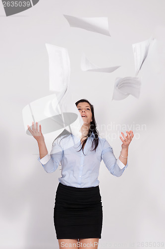 Image of Woman throws out paper into the air