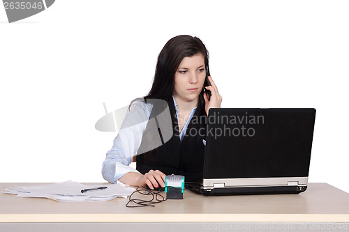 Image of Young woman behind a desk phone