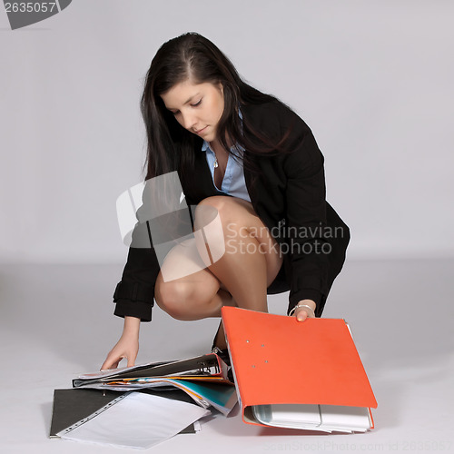 Image of Woman with lots documents
