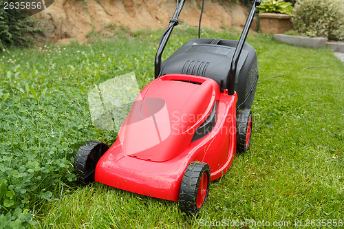 Image of new lawnmower on green grass