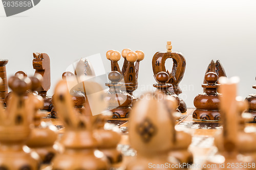 Image of chess board focus to black king and queen 