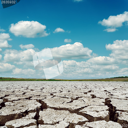 Image of drought earth and dramatic sky with clouds