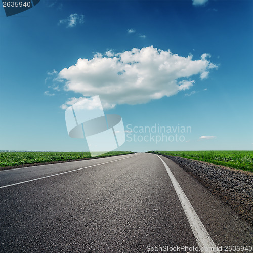 Image of one big cloud and asphalt road