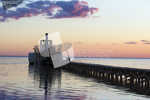Image of Ferryboat near the pier at sunset