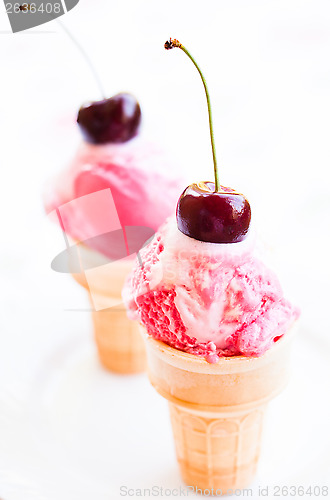 Image of Ice cream cones with cherries