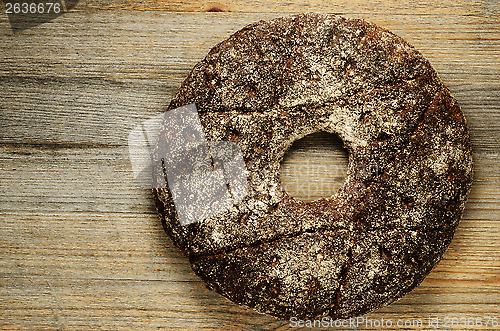 Image of finnish traditional round bread on a wooden board