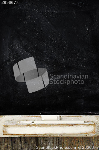Image of blank slate blackboard and chalk