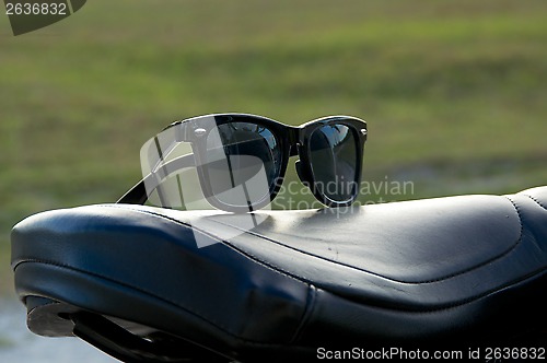 Image of sunglasses on motorcycle seat