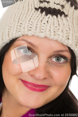 Image of Portrait of a beautiful brunette in a warm hat