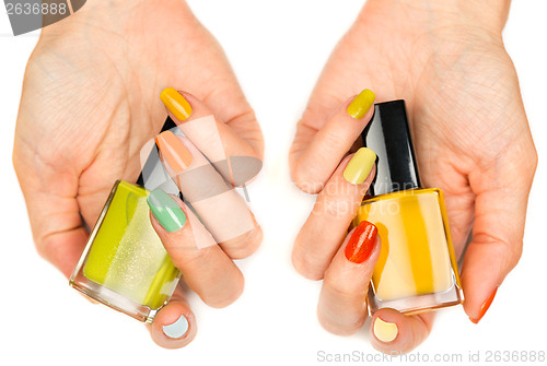 Image of Women's hands with a colored nail varnish
