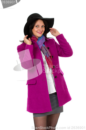 Image of Cheerful girl in a coat and hat