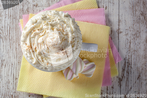 Image of hot chocolate with marshmallows and cream on wooden background