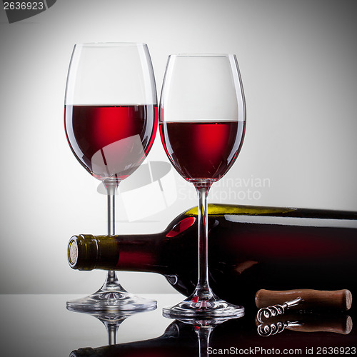 Image of Wine in glasses and bottle on white
