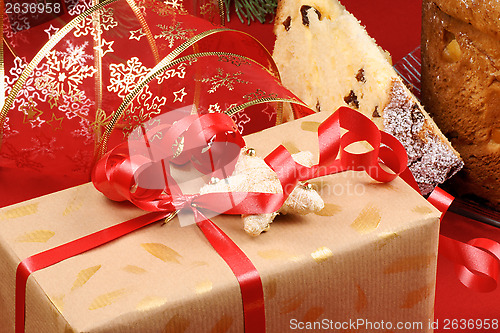 Image of Christmas composition with present and panettone