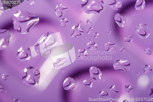 Image of violet abstract background with water drops